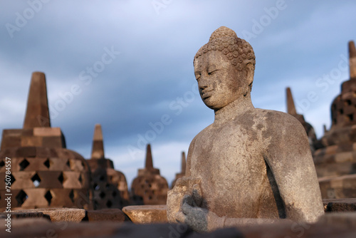 Sitting Buddha in the temple complex of Borobodur, UNESCO World Heritage Site. photo