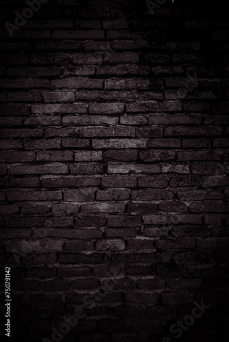 Vertical Black brick walls that are not plastered background and texture. The texture of the brick is black. Background of empty brick basement wall.