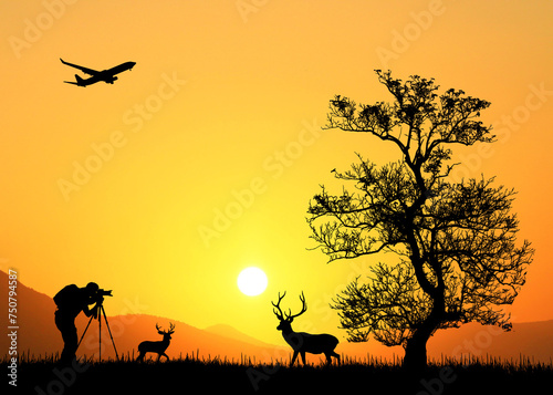 Silhouette of a professional photographer in a meadow