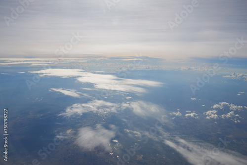 Cuadro en lienzo Aerial view seen over clouds from aircraft.