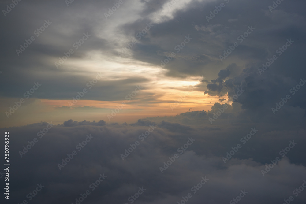 Aerial view seen over clouds from aircraft.