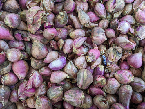 Fresh red onions at the minimarket. A pile of red onions is one of the spices in cooking