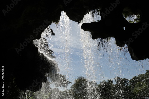interior of a rocky waterfall cave in Vincennes park photo