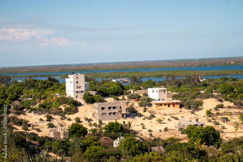 A high-angle view of a sparsely populated neighborhood on an island