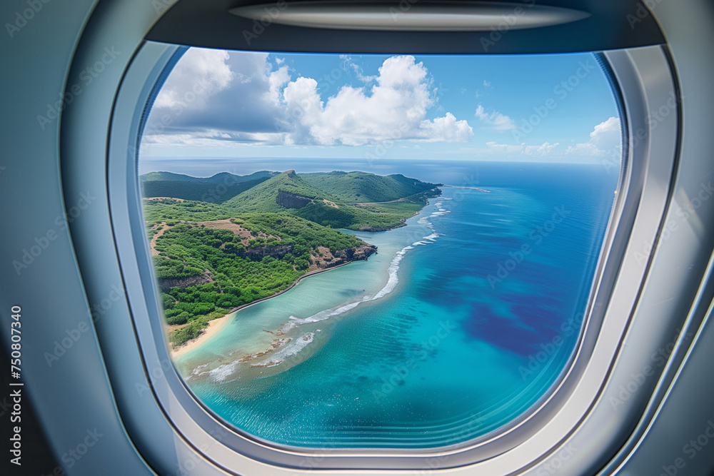 View from an airplane window with a breathtaking view of the tropical island, blue ocean and summer sky