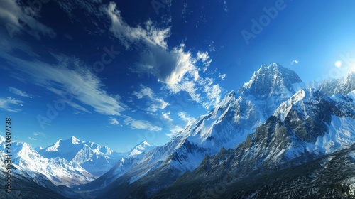 Pristine Snow-Capped Mountain Range Under a Clear Blue Sky with Sunlight Casting Sharp Shadows