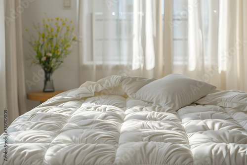 White bed, white quilted pattern mattress cover