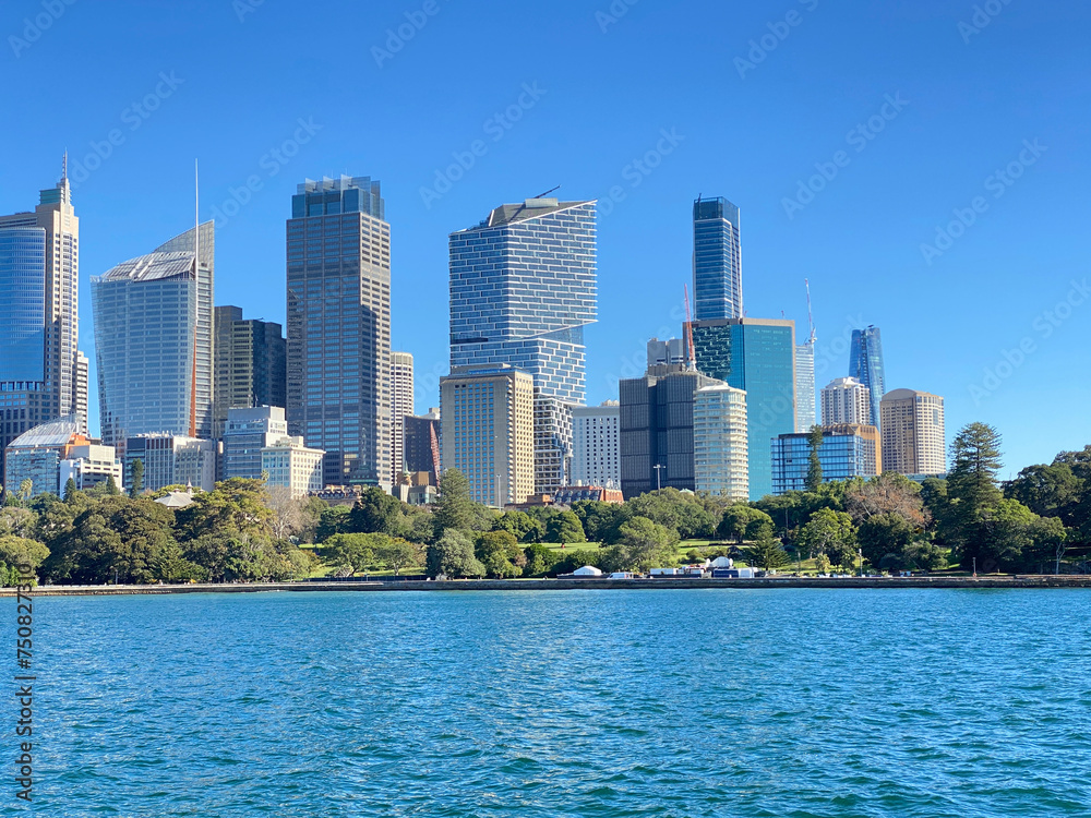 View of Sydney downtown and its iconic buildings and skyscrapers at the distance. Australian city on the horizon. City skyline from the ocean shore. City harbour country, Australia. View of Sydney downtown and its iconic buildings and skyscrapers at the distance. Australian city on the horizon. City skyline from the ocean shore. City harbour country, Australia.