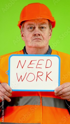 Worker holds in hands inscription need work. photo