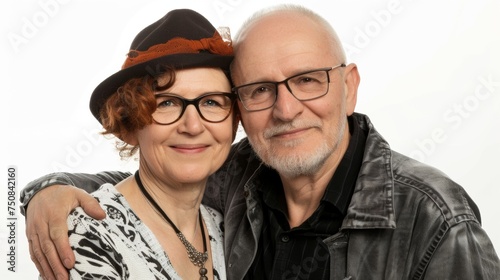 couple in love. A man and a woman, approximately 50 years old, hugging and looking happy on a white background. Family relationships and marriage. © Restyler