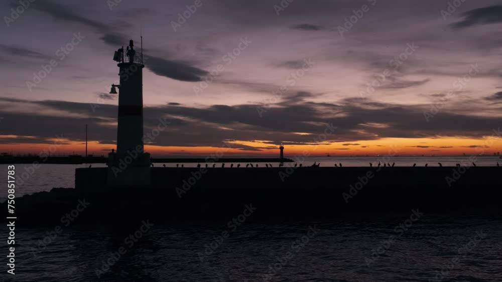 Scenic sea view of breakwater with lighthouse at sunset. Istanbul, Turkey Scenic sea view of breakwater with lighthouse at sunset. Istanbul, Turkey