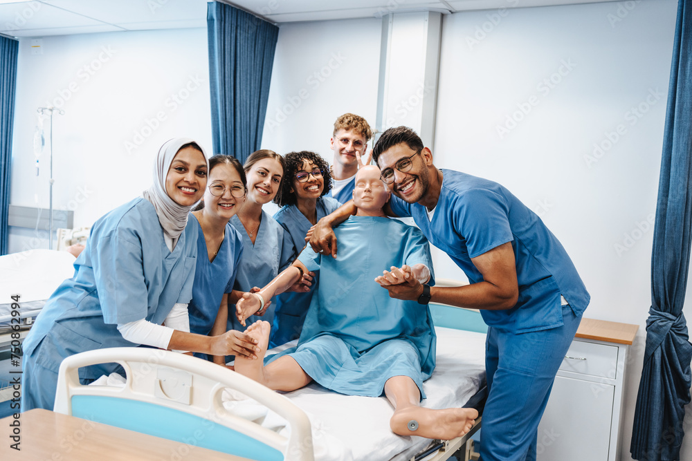 © Jacob Lund - Diverse medical class posing with a patient simulator in a teaching hospital © Jacob Lund - Diverse medical class posing with a patient simulator in a teaching hospital