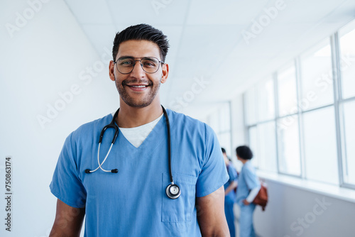 Male hospital intern looking at the camera with confidence photo
