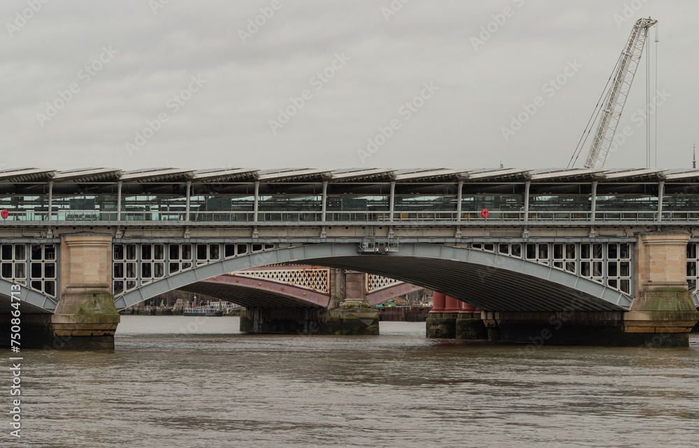 View of Blackfriars Bridge with solar panel roof and Blackfriars Bridge crossing the River Thames. Space for text, Selective Focus. View of Blackfriars Bridge with solar panel roof and Blackfriars Bridge crossing the River Thames. Space for text, Selective Focus.