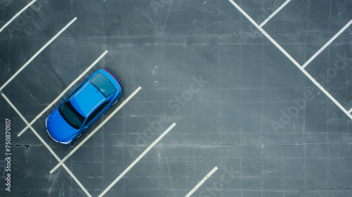 Blue car in an empty parking lot, aerial view. Parked car, top view.