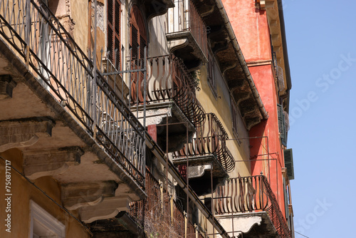 italian house facade with old balconies in Verona © Marcel