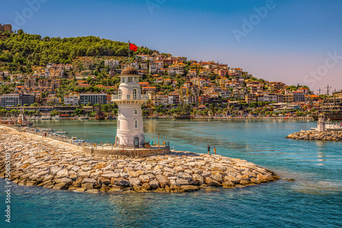 Alanya, Turkey. Old lighthouse in the harbor of the Turkish city and view of the old fortress and the Red Tower. photo