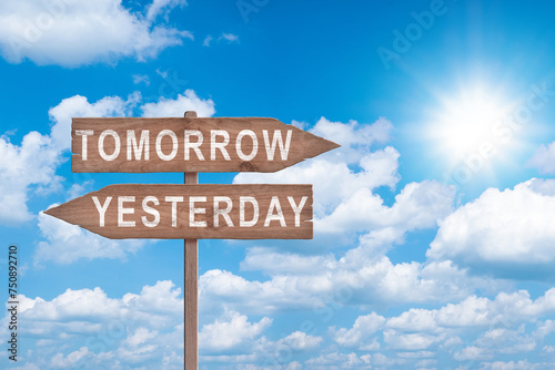 Bild auf Leinwand Tomorrow or yesterday road sign on sky background business concept