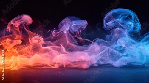 colorful smoke on a black background with red and blue smoke coming out of the top of the smoke and the bottom of the smoke is red and blue. photo