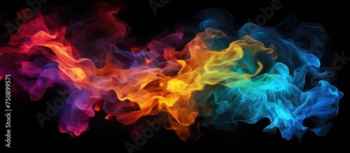 Abstract, swirling mix of colored smoke creating vibrant patterns against a black background. Realistic representation of chemical fire blasts showcasing a dynamic and colorful display.