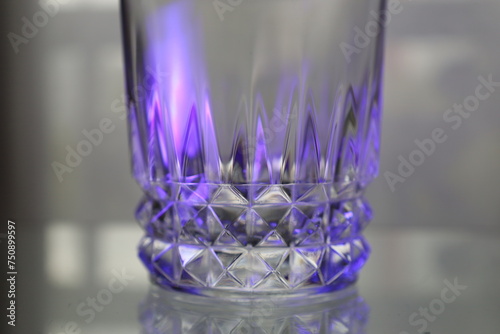 ornamentad crystal glass with purple light reflections photo