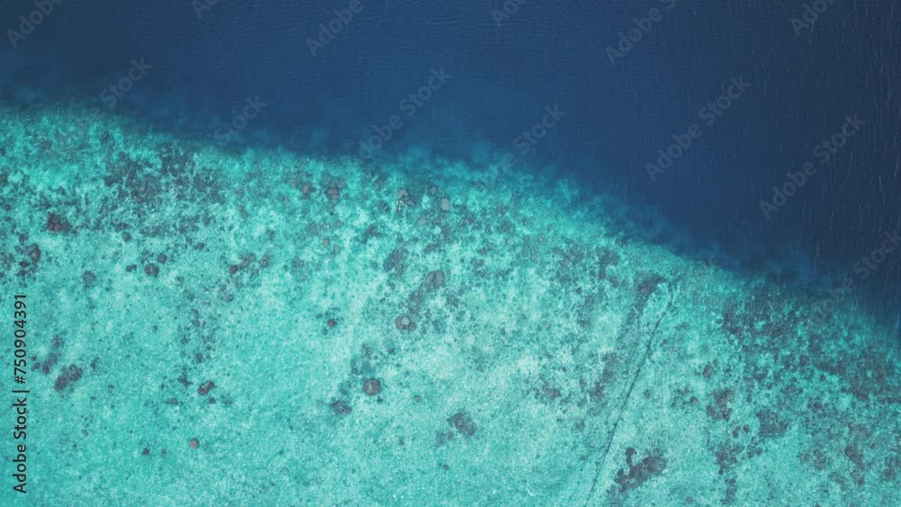 Aerial view of the reef edge in the tropical sea in the Maldives Aerial view of the reef edge in the tropical sea in the Maldives