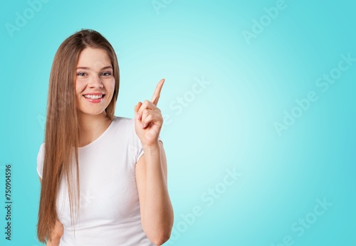 Portrait of young business woman pointing hand