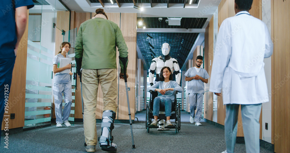 Naklejka premium Helpful automated futuristic robot pushing wheelchair with young female patient in digitalized hospital. Useful digital bot serving in modern clinic helping people. Technological development.