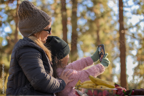 mother and daughter taking a selfie on Mother's Day