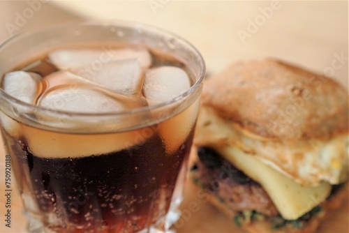 rustic burger and glass of coke