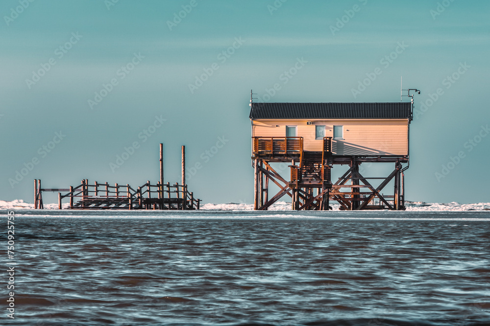 Pile dwelling on the beach of Sankt Peter-Ording in Germany. Pile dwelling on the beach of Sankt Peter-Ording in Germany.