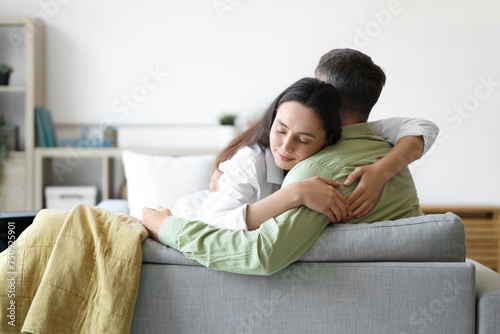 Happy young couple hugging ...