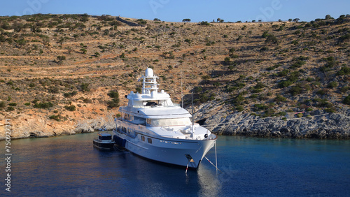 Luxury yacht anchored in Aegean island bay, Greece