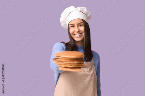 Young female chef with tast...