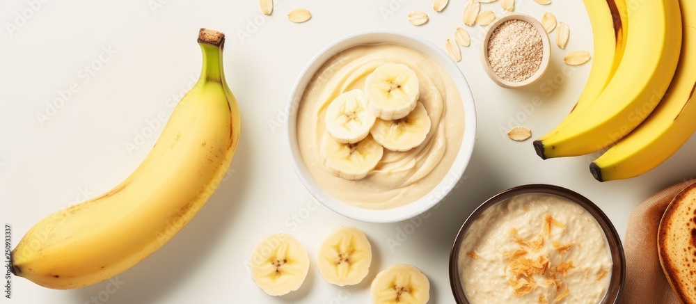 A bowl filled with oatmeal topped with slices of bananas and a dollop of peanut butter placed on a wooden table. This composition follows the BRAT diet, suitable for individuals with diarrhea or A bowl filled with oatmeal topped with slices of bananas and a dollop of peanut butter placed on a wooden table. This composition follows the BRAT diet, suitable for individuals with diarrhea or