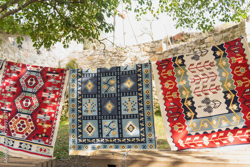 Kruja old bazar with traditional carpet in  Albania  photo