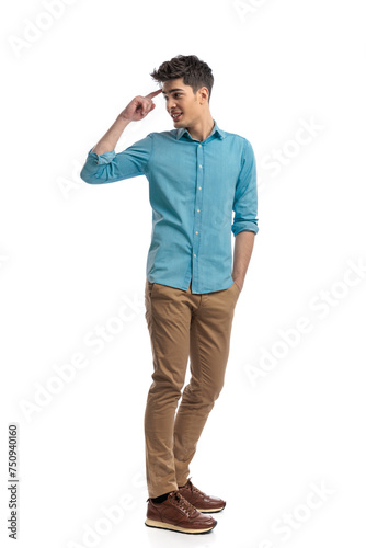 side view of relaxed casual man saluting behind © Viorel Sima