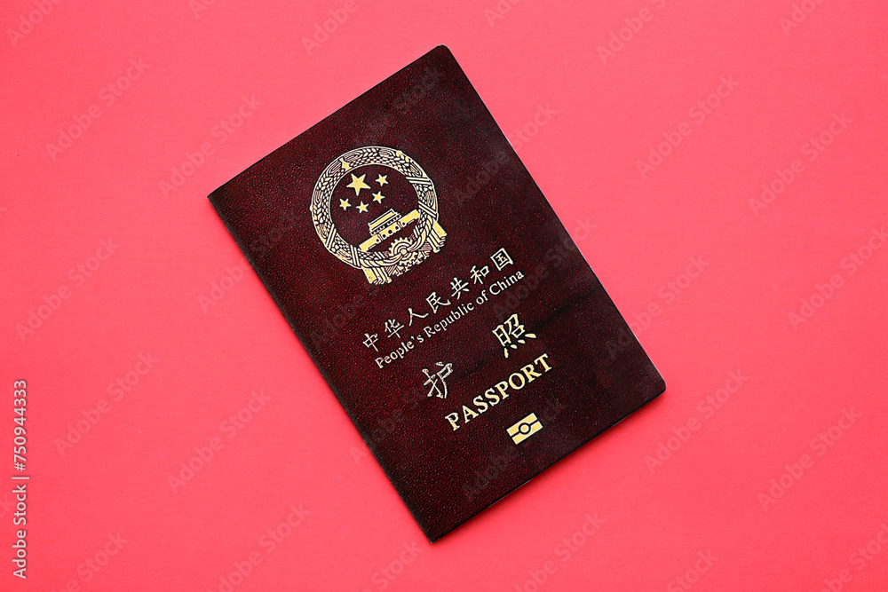 Red passport of People Republic of China. PRC chinese passport on bright background close up Red passport of People Republic of China. PRC chinese passport on bright background close up