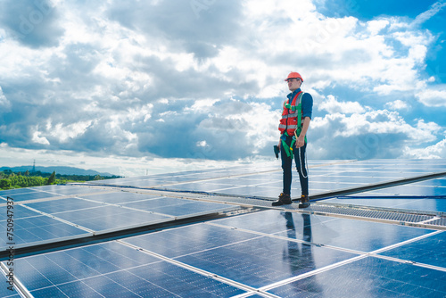 Male professional engineer installing solar photovoltaic panel system, Electrician mounting blue solar module technology on power industrial factory roof, Alternative energy ecological technician job