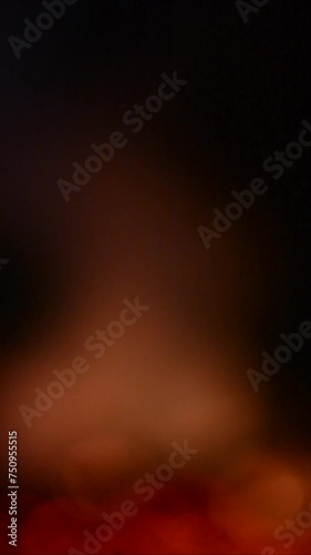 Bokeh blur lights black orange - Glowing Fire in the night - Fireplace campfire