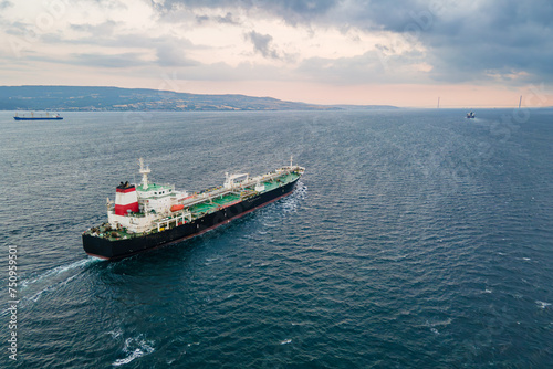 Crude Oil tanker carrier ship underway through Dardanelles Strait, aerial view, concept worldwide logistic and global trade