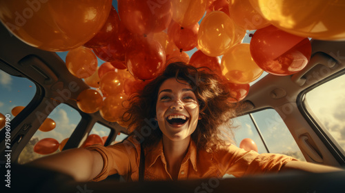 Cheerful, happy, and surprised girl with curly hair inside a car filled with colorful balloons, in daylight, with warm, soft, and vibrant colors.