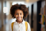Smiling student girl. Portrait of happy african american young girl outside the primary school. Closeup face of smiling schoolgirl looking at camera.