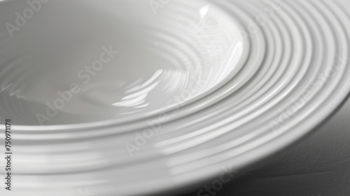A close-up shot of a white bowl on a table, suitable for various food or kitchen-related concepts © Fotograf