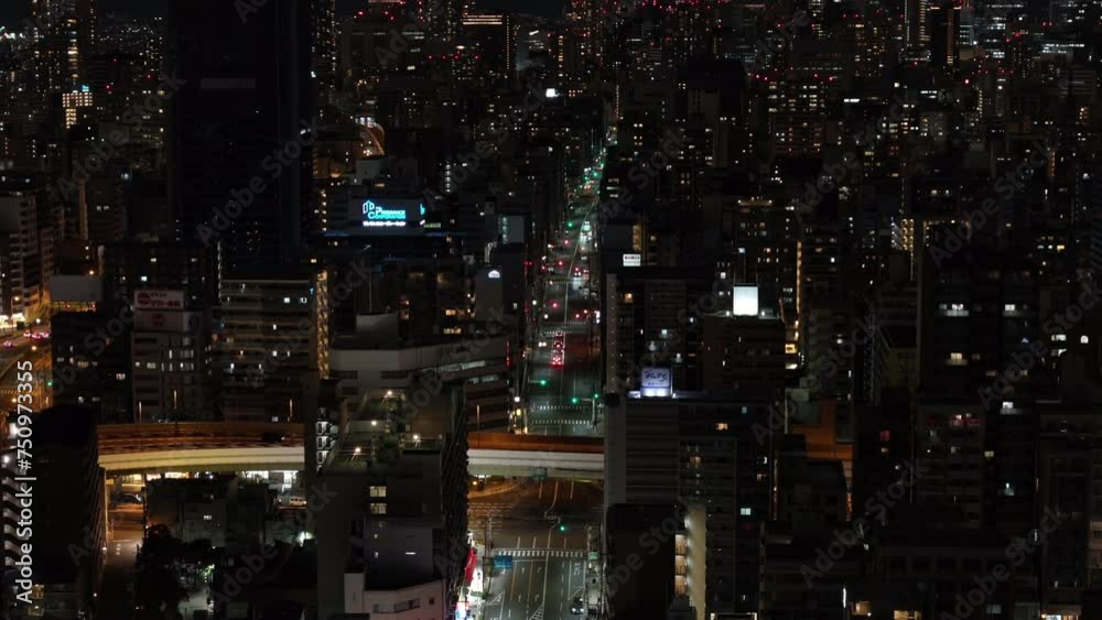 High angle view of streets and buildings in night city. Residential district in metropolis. Osaka, Japan