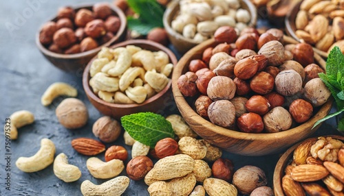 colorful mix of various nuts peanut and cashew hazelnut and almond pine nuts and walnut healthy diet snack vegan food background
