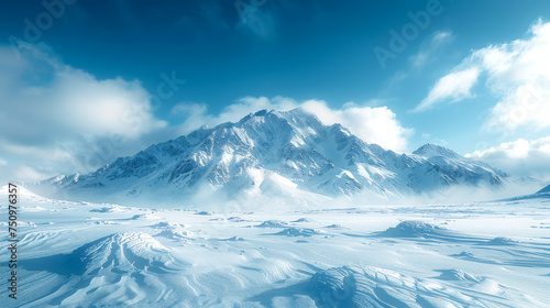 Scenic view of a snowy mountain range and a blue sky. Winter, nature, and landscape concept.