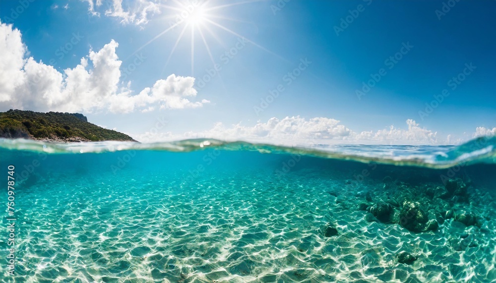 split underwater view with sunny sky and serene sea