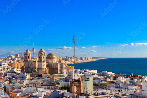 Aerial panoramic view of the old city rooftops and Cathedral de Santa Cruz from tower Tavira in Cadiz, Andalusia, Spain
