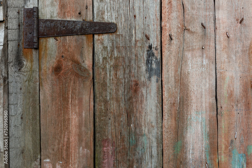 texture of old boards on a vintage door with old hinges